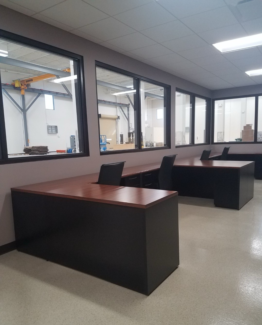 Modern office space with ergonomic chairs and desks